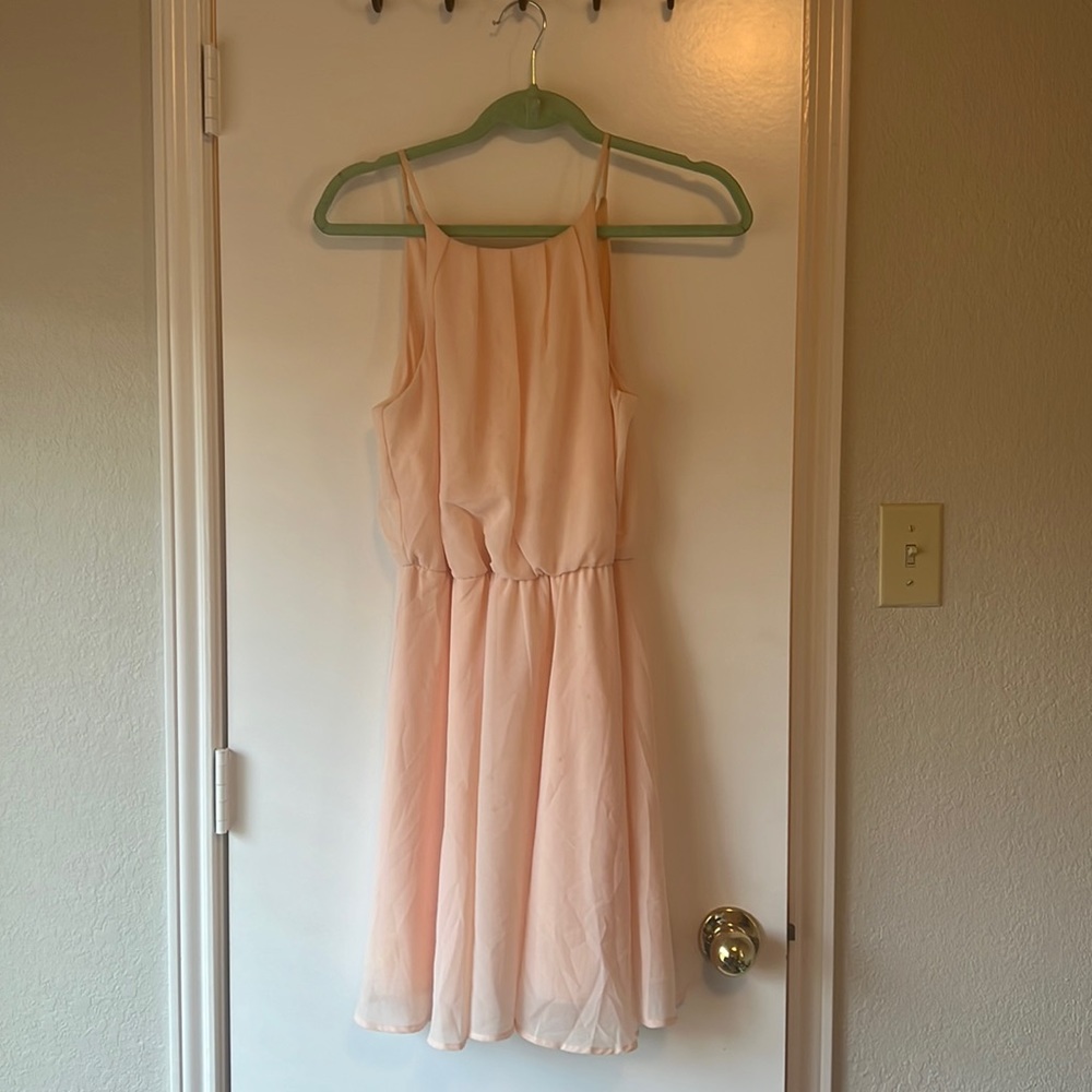 Peach dress. IT DOES HAVE STAINS AND SOME DISCOLORATION.